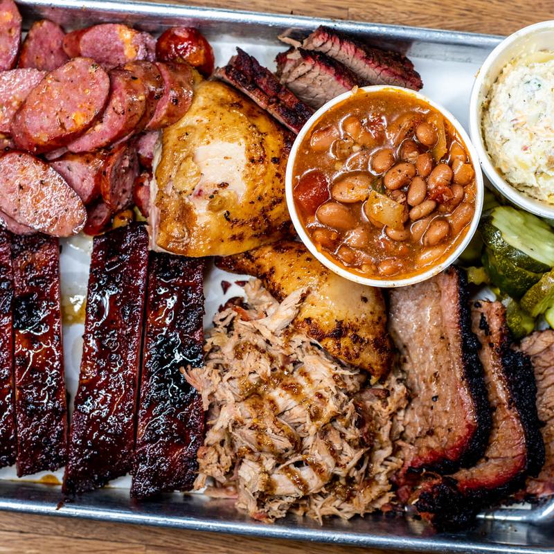 Shack Pack 1 BBQ spread with brisket, sausage, turkey and sides